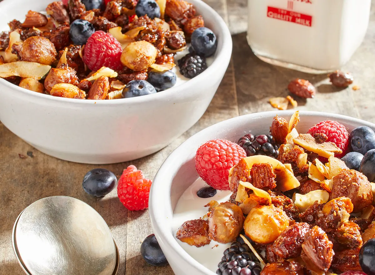 Keto nut and granola recipe in a bowl with fruit and milk