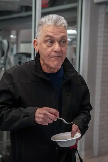 Kenneth Cusano gave a thumbs up to MetroWest YMCA Director of Nutrition Maggie Lynch's sweet potato black bean burgers served up Feb. 8, 2024 for National Heart Health Month.