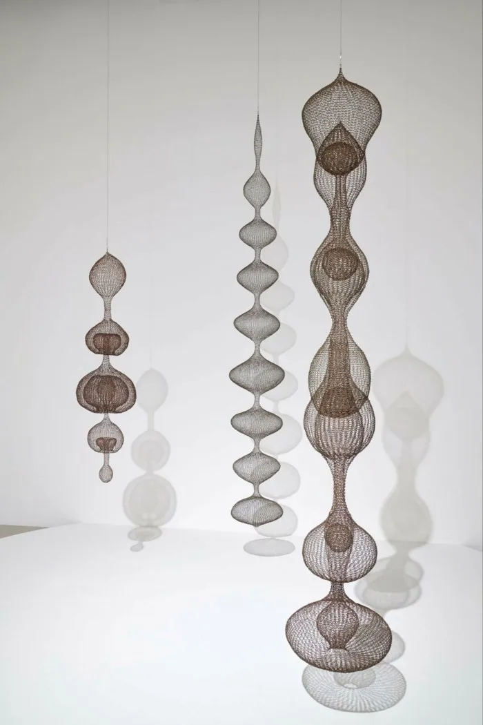 Sculpture of multiple round shapes on pendant