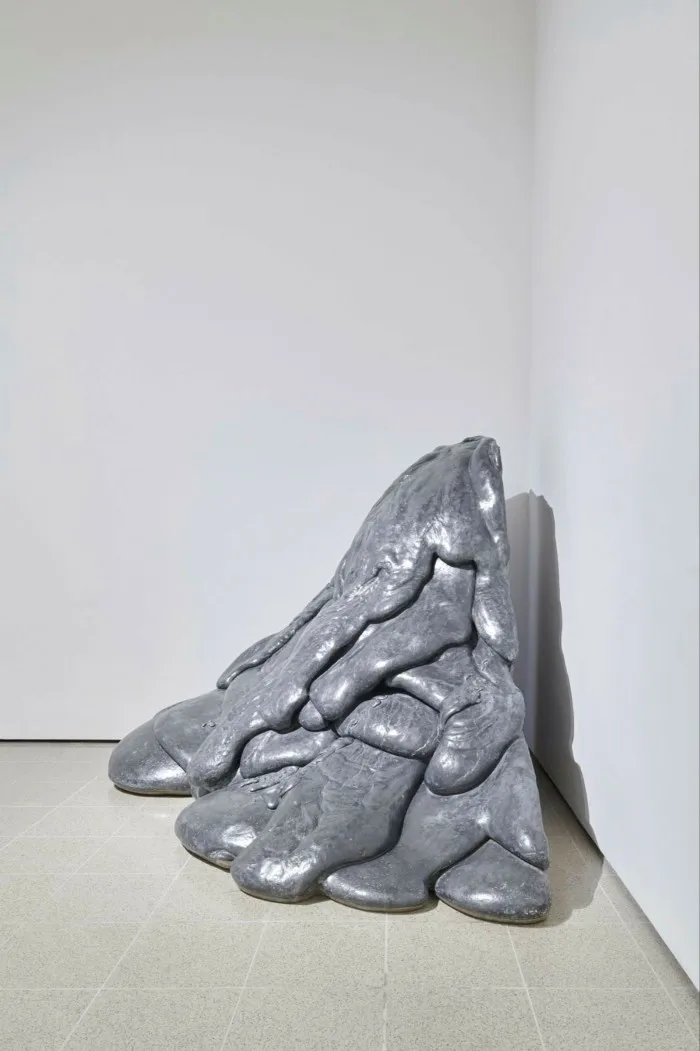 Sculpture of lava type flow against corner walls