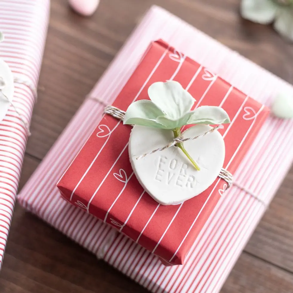 a red and white napkin with a plant on it