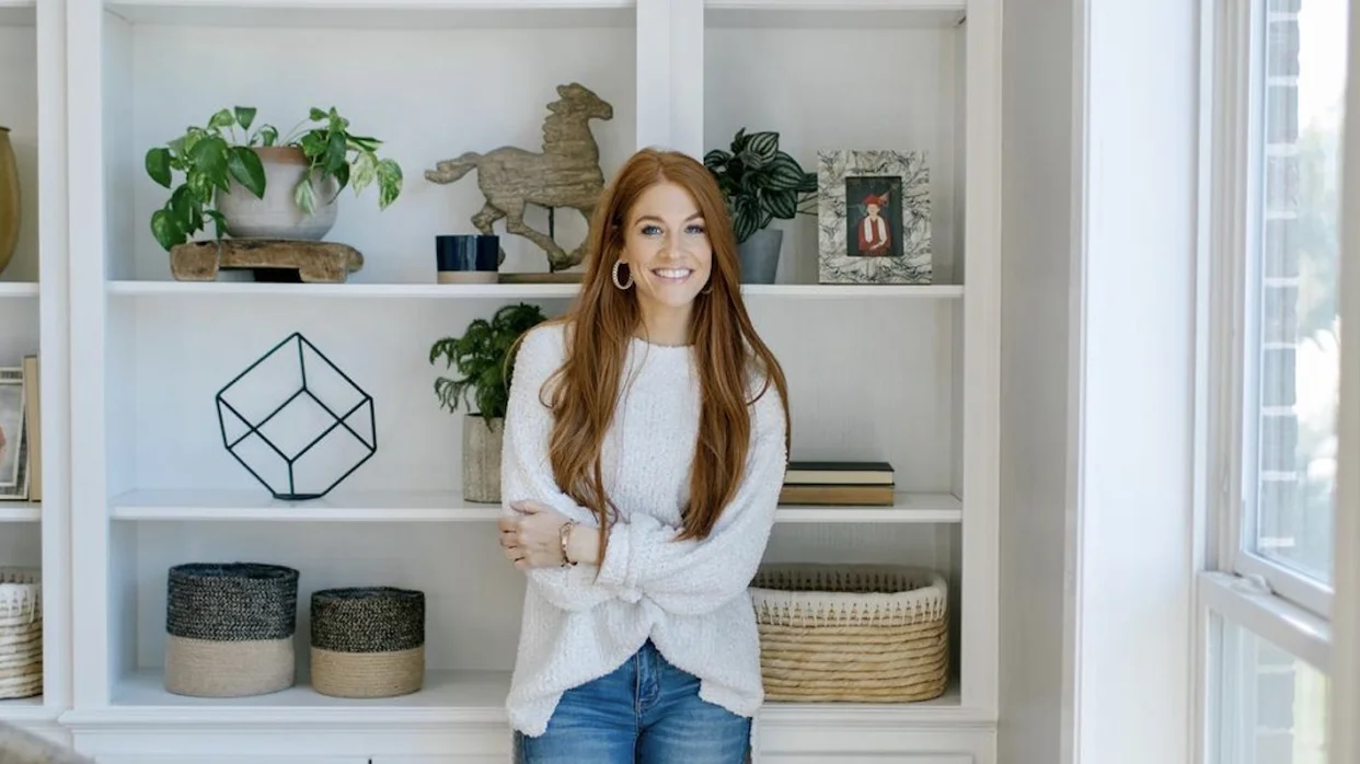 jenn todryk standing in front of a white cabinet