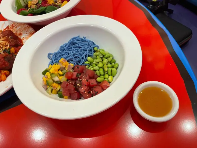 Wide shot of the Red Fish Blue Fish Poke Bowl and dressing ramekin