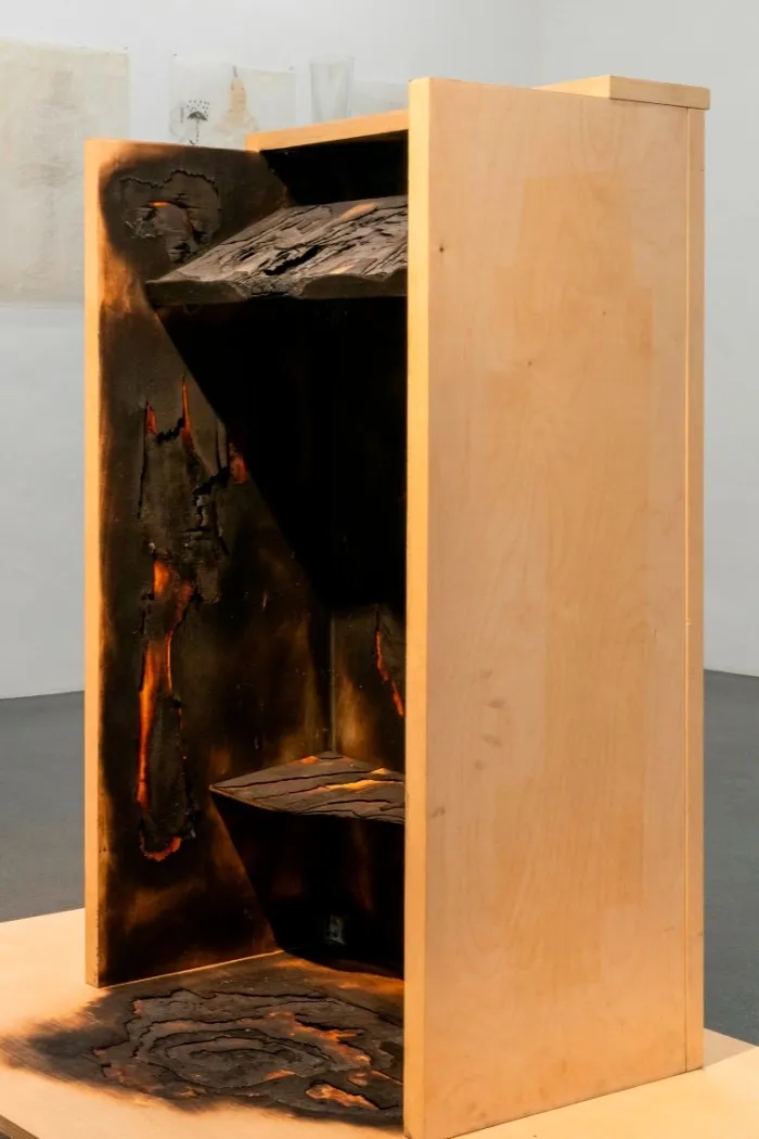 A lectern whose rear is charred