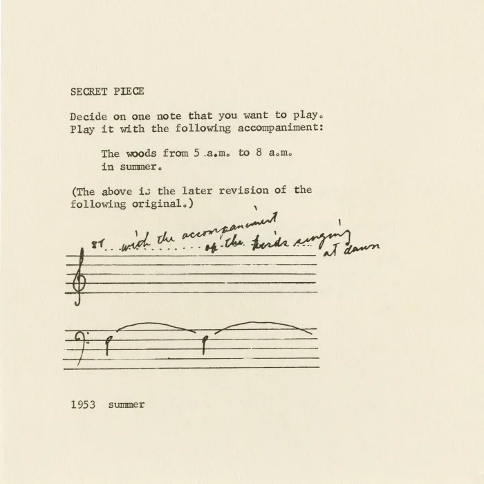 A sheet of paper with writing and musical notes