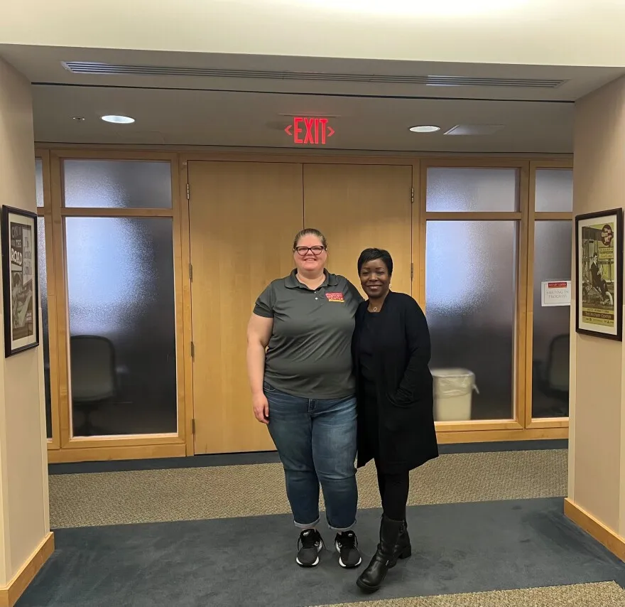 Katie Kelly, Curator of Education at the Orange County Regional History Center, stands next to artist Lisa Moore for a portrait at the History Center in Downtown Orlando.