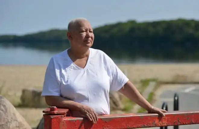 Sherry Pocknett, owner of the Sly Fox Den Too in Charlestown, Rhode Island, received the James Beard Foundation Award for Best Chef Northeast in 2023. She is photographed at Mashpee Pond on Cape Cod, where she grew up.