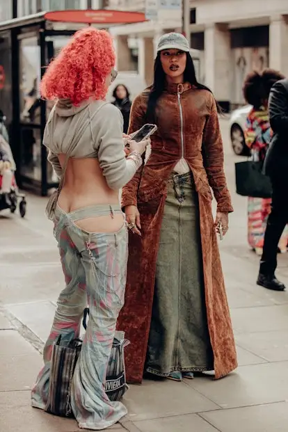 Neon red hair color London Fashion Week street style FW 2024