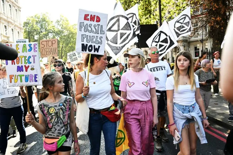 Episode 3: Katherine Ryan and daughter Violet with Sophie Broadbent and family at protest march