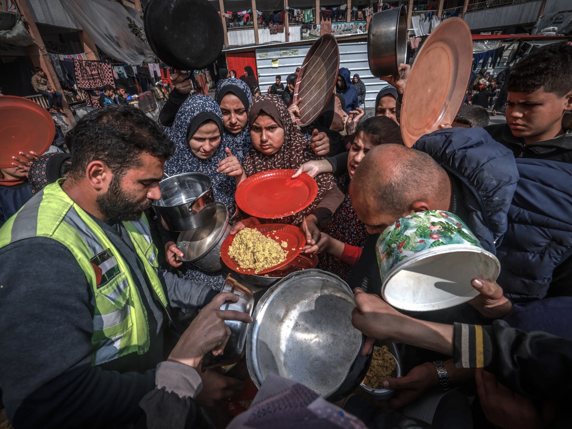 Israeli forces kill, wound Palestinians waiting for food aid in Gaza