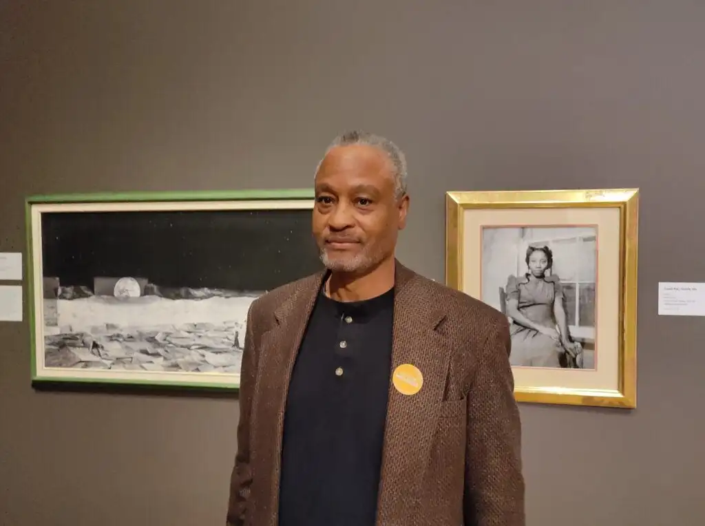 Ron Tarver, CFEVA fellow in 1997, in front of his photographic pieces.