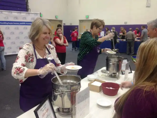 In this 2018 file photo, Monica White, president and CEO of Food Share, serves soup during Many Mansions’ 17th Annual Bowls of Hope event at California Lutheran University in Thousand Oaks. White recently shared about a scam that was attempted on the Oxnard nonprofit and offered a warning to other organizations.