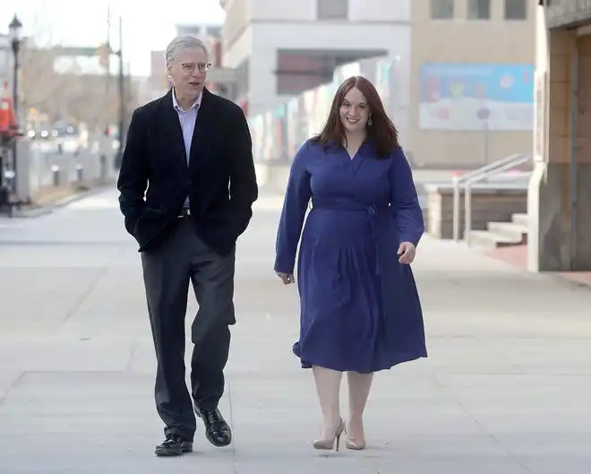 Development Finance Authority of Summit County President Chris Burnham and Vice President Rachel Bridenstine walk along Main Street in Akron. Bridenstine is succeeding Burnham when he retires at the end of the year.