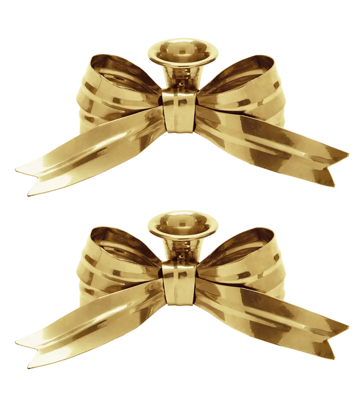 a pair of bow-shaped candle holders