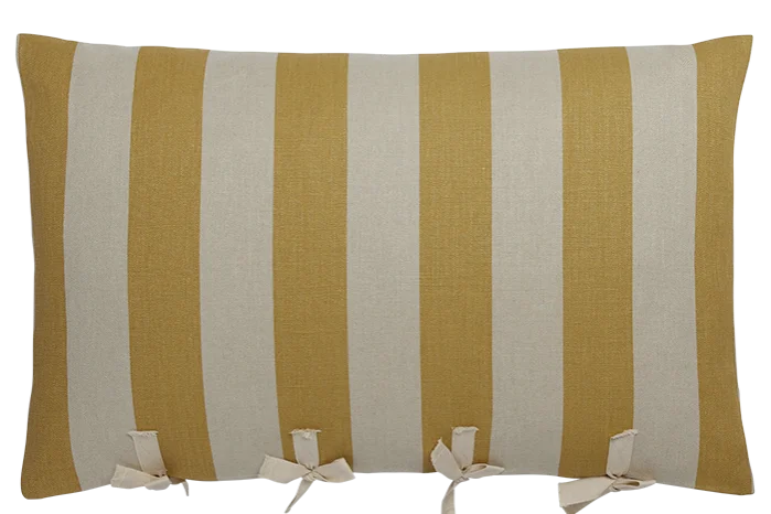 a fluffy striped cushion with ties on one edge