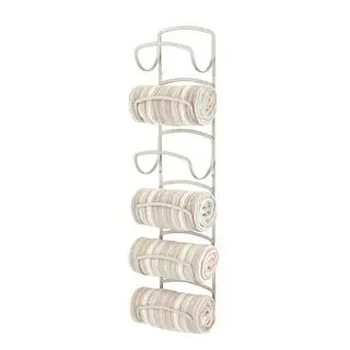 Gold towel rack holding rolled towels