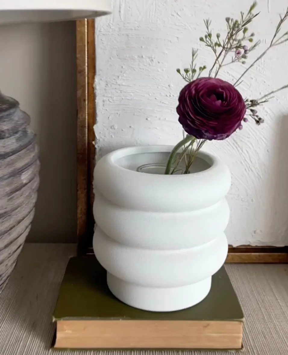 She styled the bubble vase from Walmart, which retails for $8.50, with her own flowers