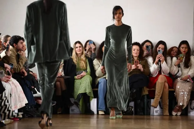 A model presents a creation by South Korean designer Eudon Choi during the catwalk presentation for his Autumn/Winter 2024 collection during London Fashion Week in London on February 18, 2024. (Photo by HENRY NICHOLLS / AFP) (Photo by HENRY NICHOLLS/AFP via Getty Images)