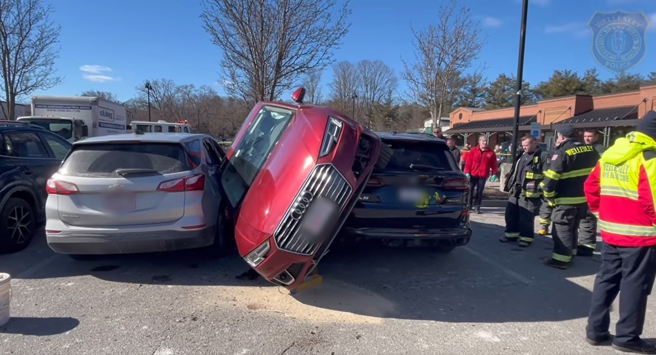 Parking lot crash leaves car wedged between two others