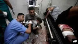 Palestinians wounded in the Israeli bombardment of the Gaza Strip receive treatment at Nasser Hospital in Khan Younis, in the southern Gaza Strip, Jan. 22, 2024.