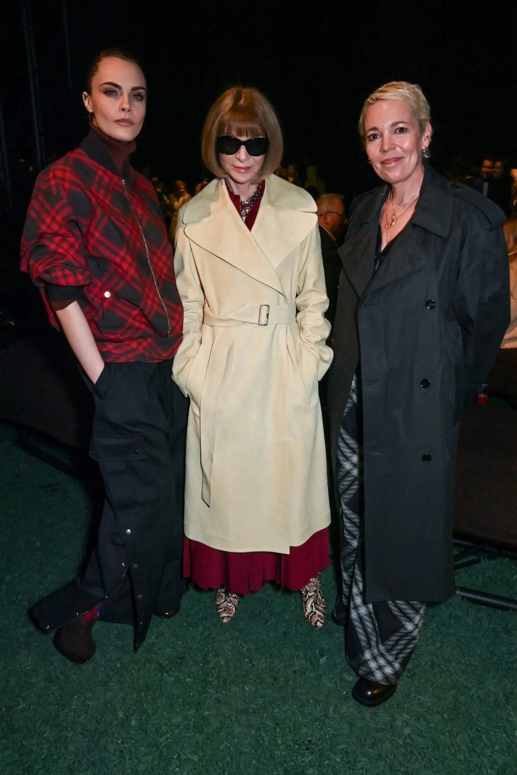 PHOTO: Cara Delevingne, Editor-In-Chief of American Vogue and Chief Content Officer of Conde Nast Dame Anna Wintour and Olivia Colman attend the Burberry Winter 2024 show during London Fashion Week on Feb. 19, 2024 in London.