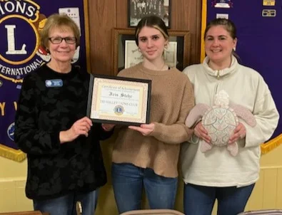 Betty Kroh, Tri-Valley Lions Club 2nd vice president, presents Iris Stehr with her Certificate of Achievement as Feb. Outstanding Student of the Arts, joined by the winner's mother, April Stehr. (Courtesy of Tri-Valley Lions Club)