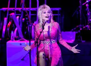 NASHVILLE, TENNESSEE - OCTOBER 24: Dolly Parton performs at the 2021 Kiss Breast Cancer Goodbye Concert at CMA Theater at the Country Music Hall of Fame and Museum on October 24, 2021 in Nashville, Tennessee. (Photo by Jason Kempin/Getty Images)