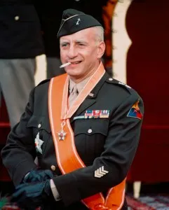 George C Scott (1927-1999), US actor, in ceremonial military uniform, with an orange sash, and smoking a cigarette in a publicity still issued for the film, 'Patton', 1970. The biopic, directed by Franklin J Schaffner (1920-1989), starred Scott as 'General George S Patton'. (Photo by Silver Screen Collection/Getty Images)