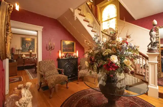 Entranceway leading to the dining room and main staircase of Randy Klinger’s home in Olde Towne East