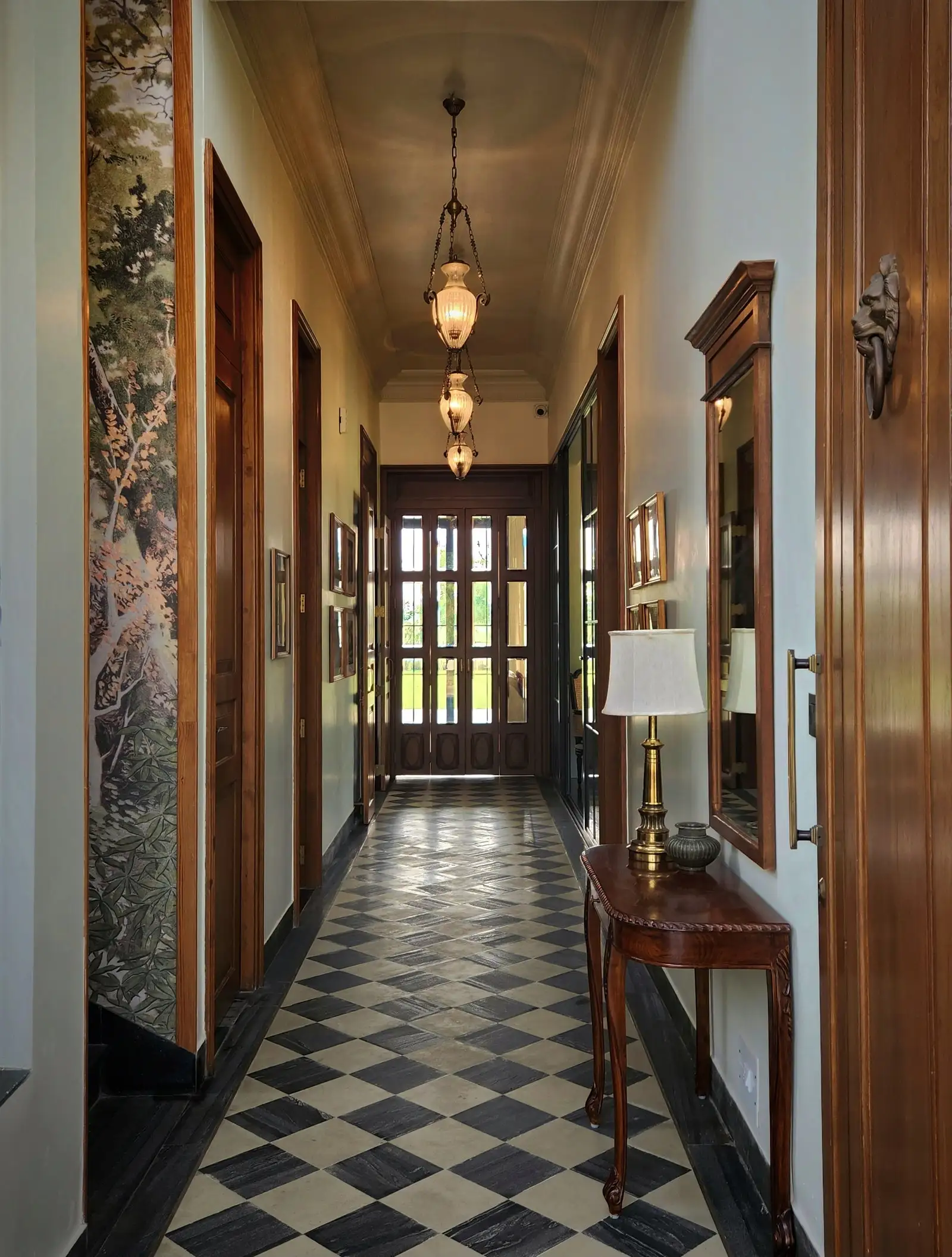 Image may contain Lamp Indoors Floor Architecture Building Foyer Hallway and Person