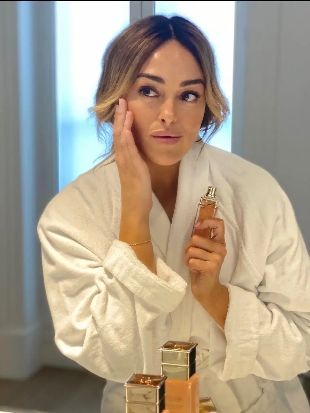 Alessandra Steinherr applying skincare 