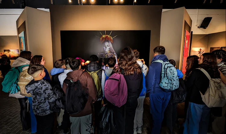 School pupils looking at an image at Terra Incognita photo exhibition at Technopolis, Athens. 