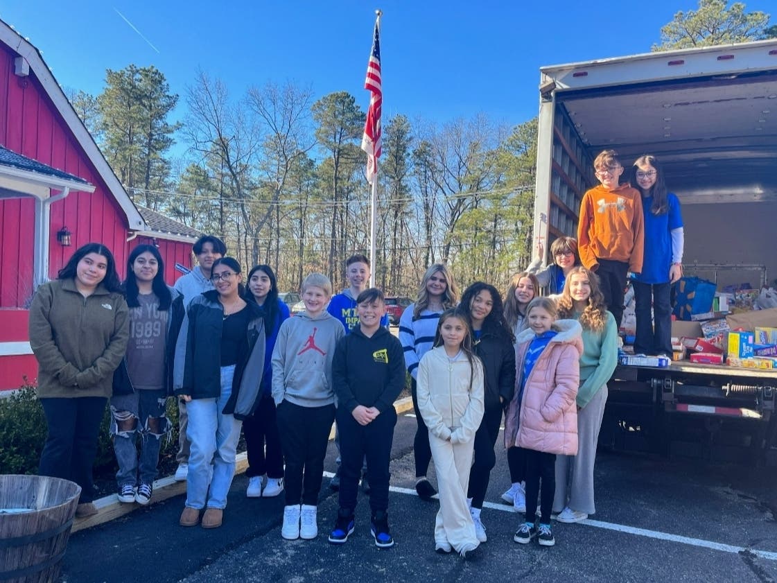 Manchester Schools’ ‘Cereal War’ Delivers Hunger Relief To Food Pantry