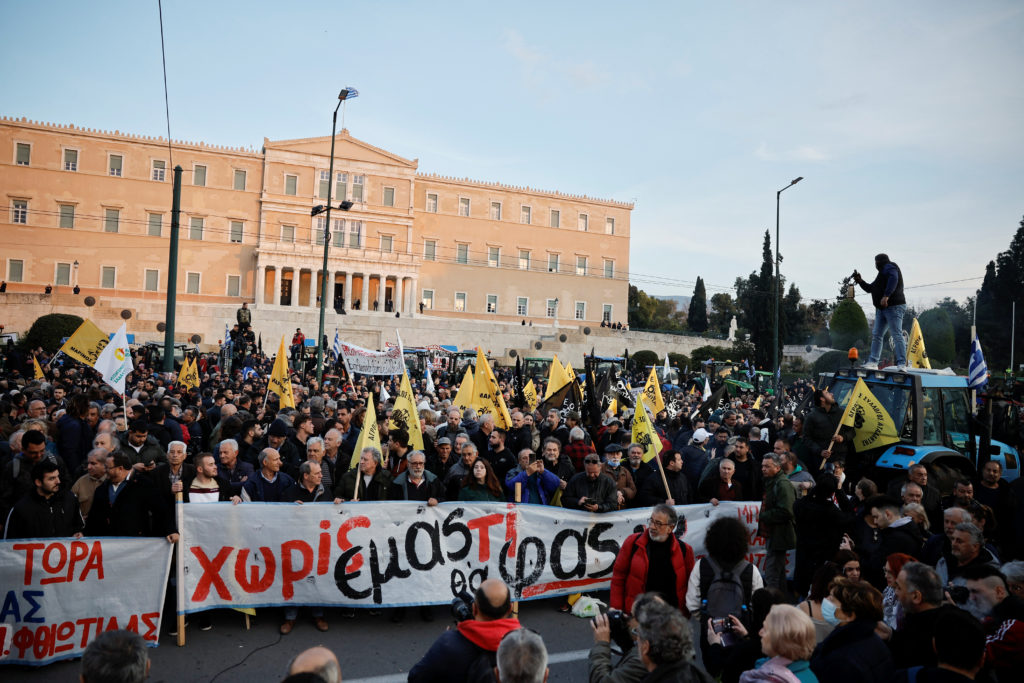 Greek farmers drive tractors to parliament to demand financial help