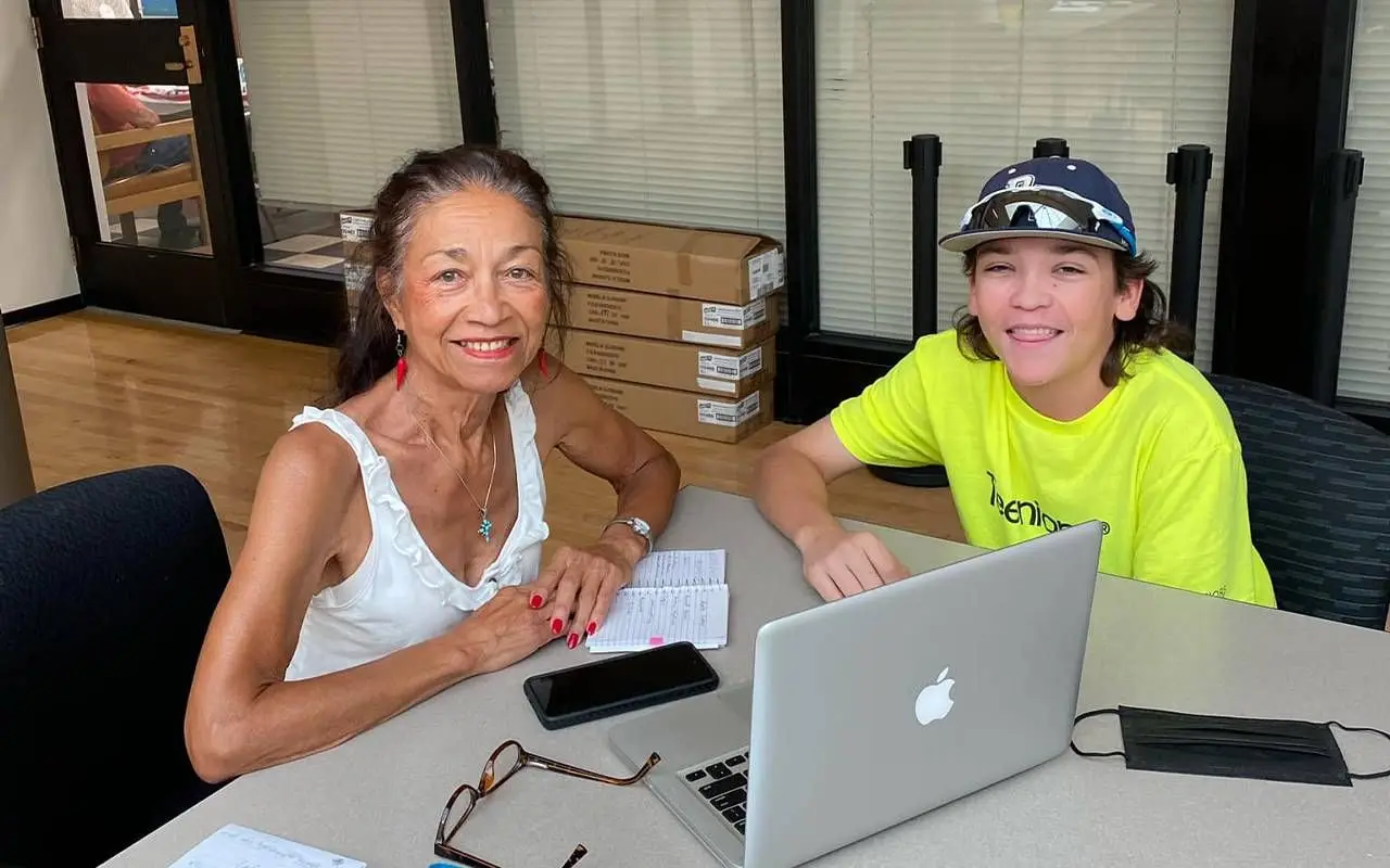 A young person tutoring an older adult. Next Avenue, digital buddy, social connection