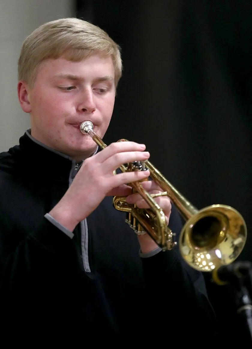 Student plays trumpet.