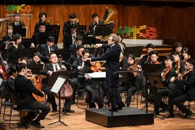 Music Director Daniel Harding conducts the YMCG Symphony Orchestra at the 2024 Youth Music Culture the Greater Bay Area.