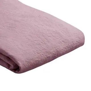 A folded raspberry pink-purple linen duvet cover 