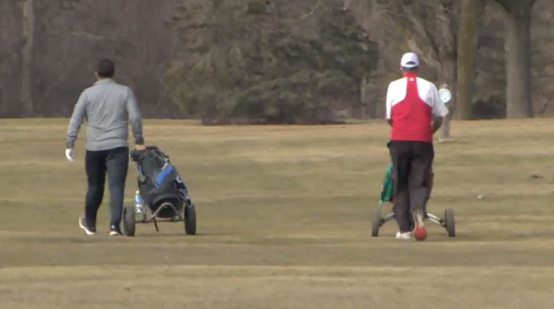 Warm weather brings business to area golf courses and car washes