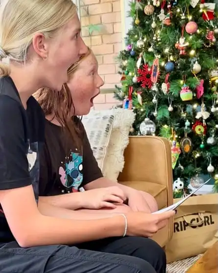 Daisy and Summer pictured finding out they were going to see Taylor Swift perform in Singapore over Christmas