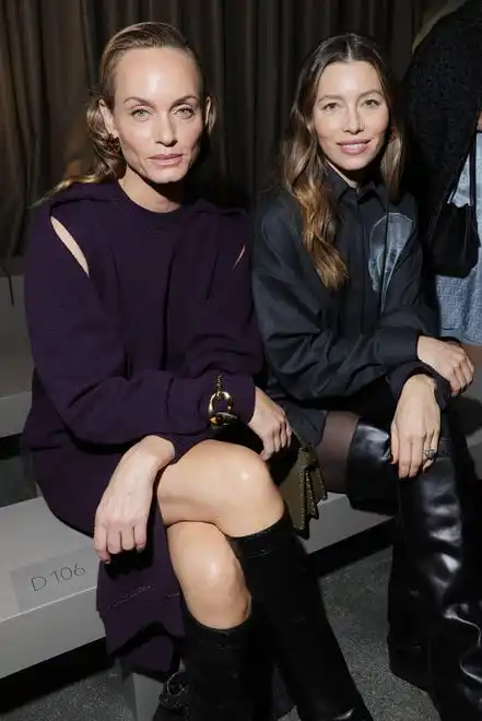 Jessica Biel, right, and Amber Valletta sit side by side during the Fendi fashion show.