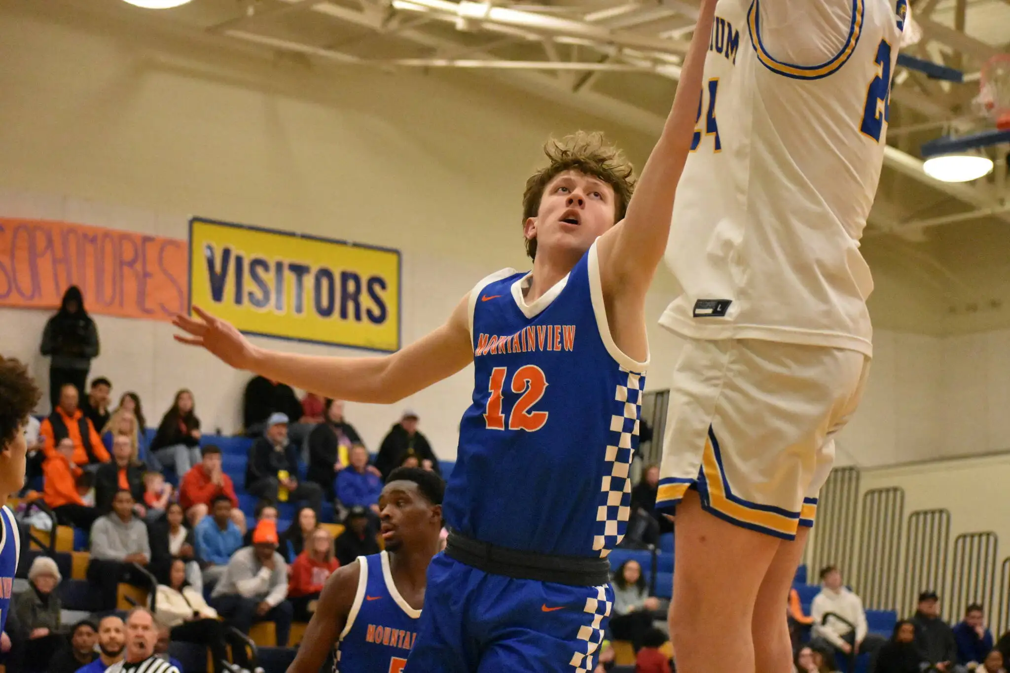 Spencer Evenson contests a jump shot at Stadium High School. Ben Ray / The Reporter