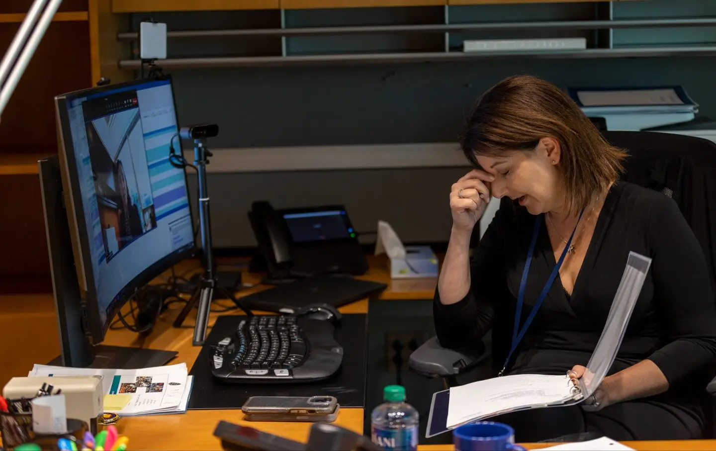 Centers for Disease Control and Prevention Director Dr. Mandy Cohen rubs her head while taking notes during her end-of-day check-in inside her office at the Centers for Disease Control and Prevention headquarters in Atlanta, Ga., on Thursday, September 21, 2023.