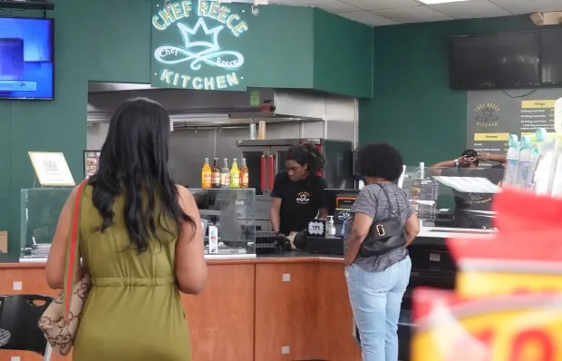 Customers line up for lunch at Chef Reece Kitchen inside a gas station in Pembroke Pines, Thursday, Feb. 15, 2024. Black culinary excellence will be celebrated at five newish events during next week's 2024 South Beach Wine and Food Festival, returning Feb. 22-25 with a smorgasbord of 110 events across Miami-Dade and Broward counties. (Joe Cavaretta/South Florida Sun Sentinel)