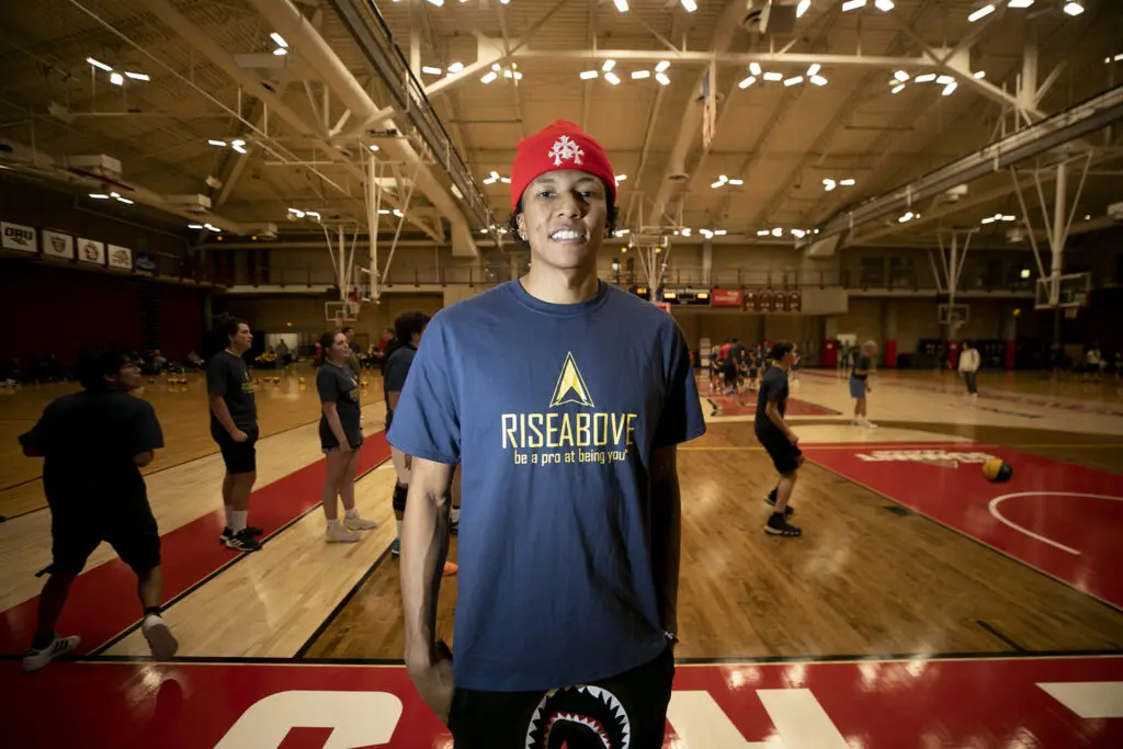 Milwaukee Bucks player Marjon Beauchamp helps out with Rise Above Basketball's clinic at the University of Denver. Jan. 28, 2024.