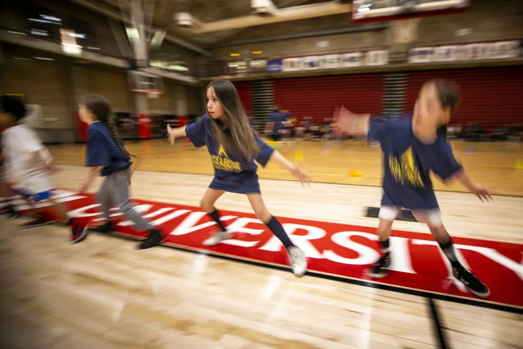 Raven (8) runs defense drills during Rise Above Basketball's clinic at the University of Denver. Jan. 28, 2024.