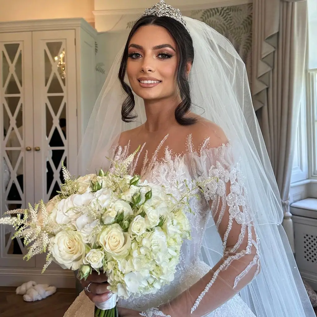 bride with hair up, veil and tiara