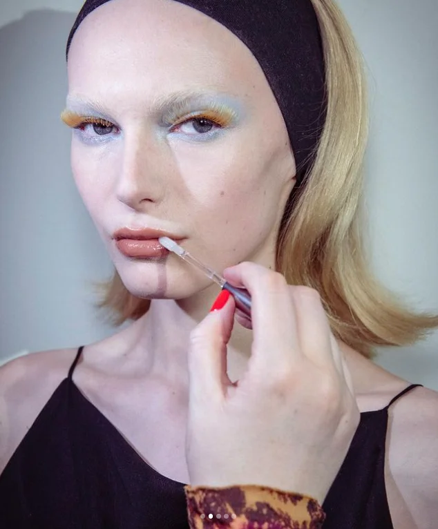 A model at the Conner Ives show with yellow lash extensions and light blue eyeshadow. Photo: Instagram/Lucy Bridge