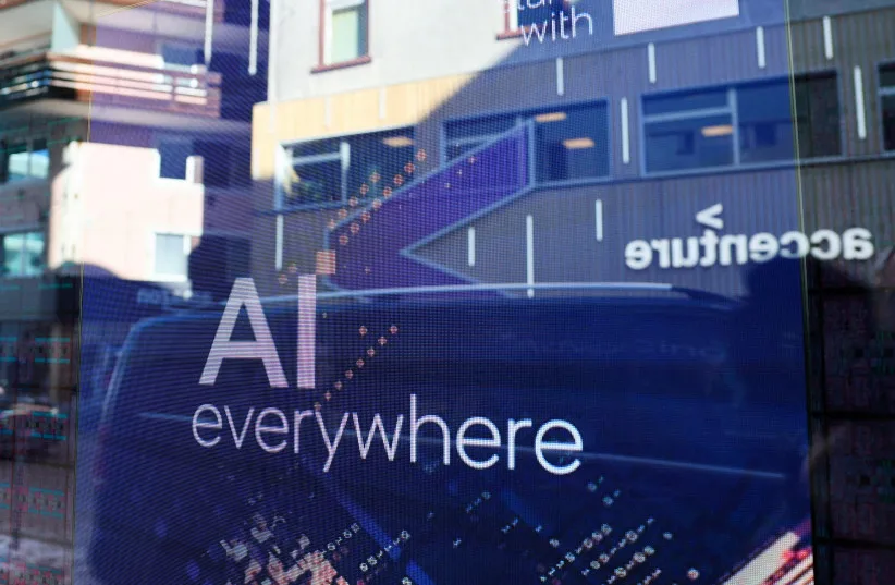  A slogan related to Artificial Intelligence (AI) is displayed on a screen in Intel pavilion, during the 54th annual meeting of the World Economic Forum in Davos, Switzerland, January 16, 2024. (credit: REUTERS/DENIS BALIBOUSE/FILE PHOTO)