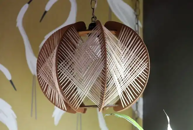 A wicker-style hanging lamp in one of the sitting rooms.